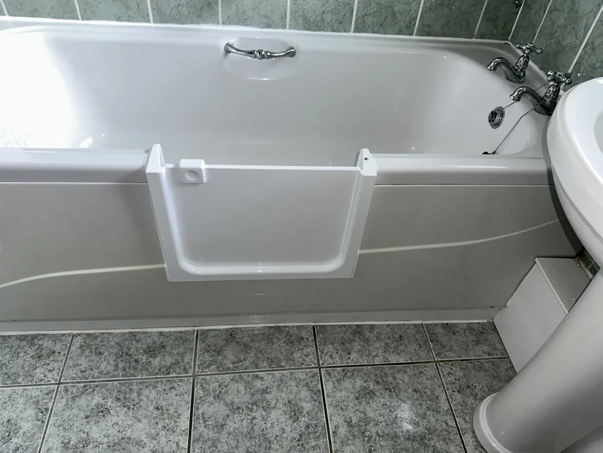 A bath with a UDOOR® door fitted, in a customer's own bathroom